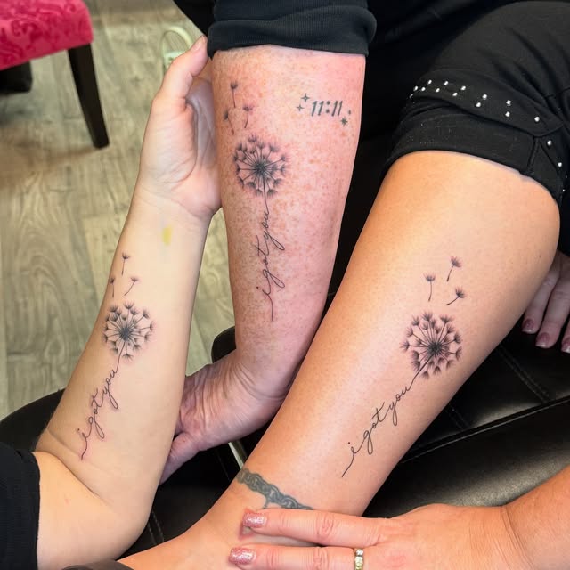 Three matching dandelion and "i got you" script tattoos on friends' forearms