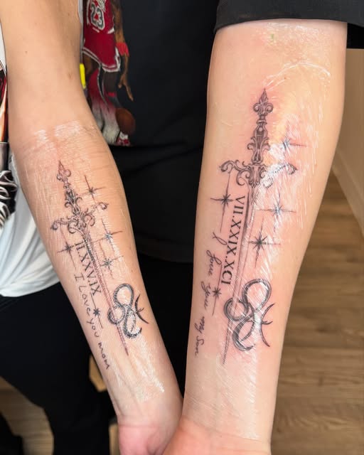 Matching mother and son dagger and script forearm tattoos, wrapped