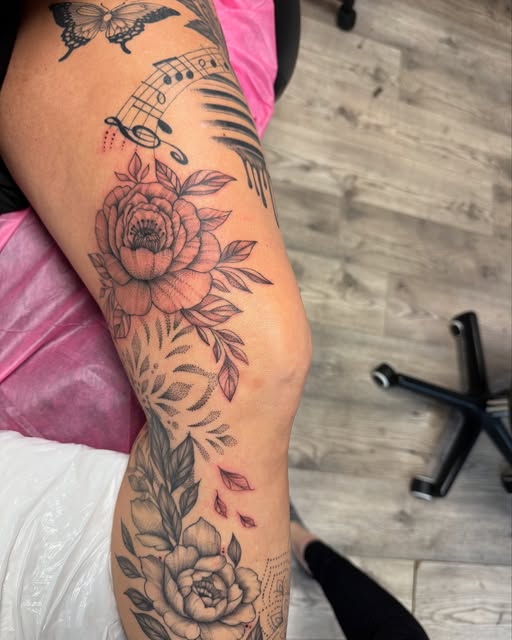 Peony and floral leg sleeve with music notes, partly healed