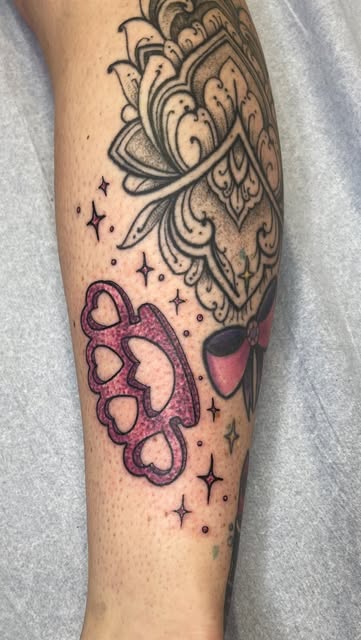Glitter pink brass knuckles and mandala on the calf