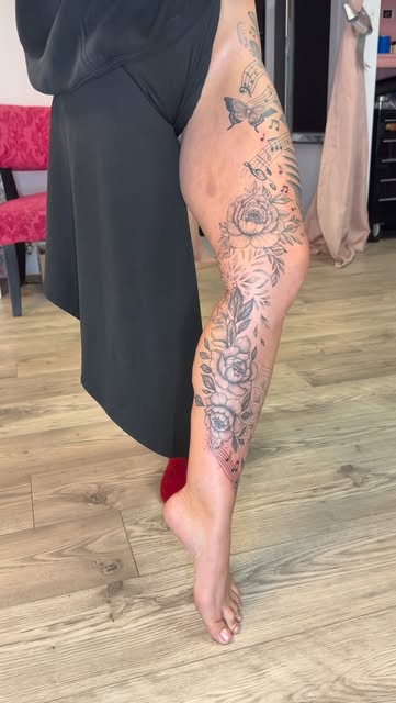 Floral and music note leg piece running up the thigh