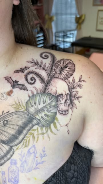 Chest piece in progress with a moth, skull, monstera and bats