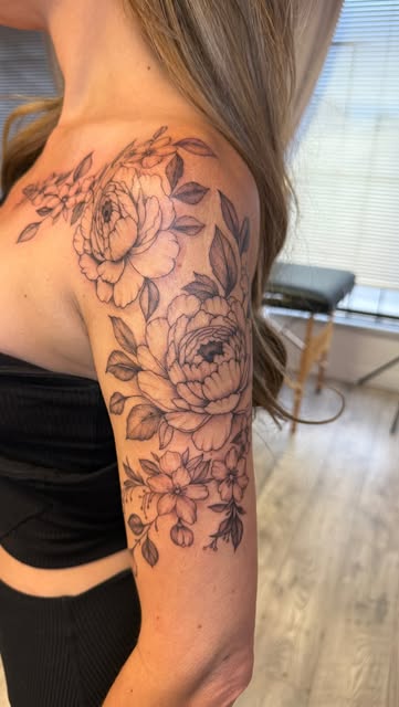 Peonies and blossoms fine line piece on the shoulder