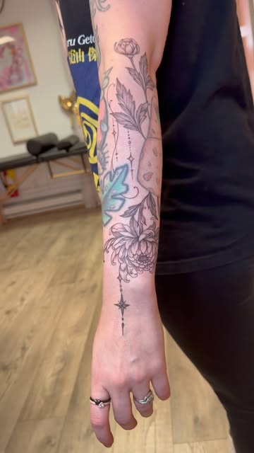 Floral and ornamental add-on connecting existing forearm tattoos