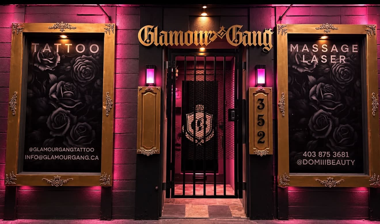 The Glamour Gang storefront at 352 Leon Avenue at night, gold sign and frames lit pink